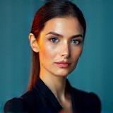 Portrait of Dr. Elena Petrova, MD, Wellness & Tech Innovator.